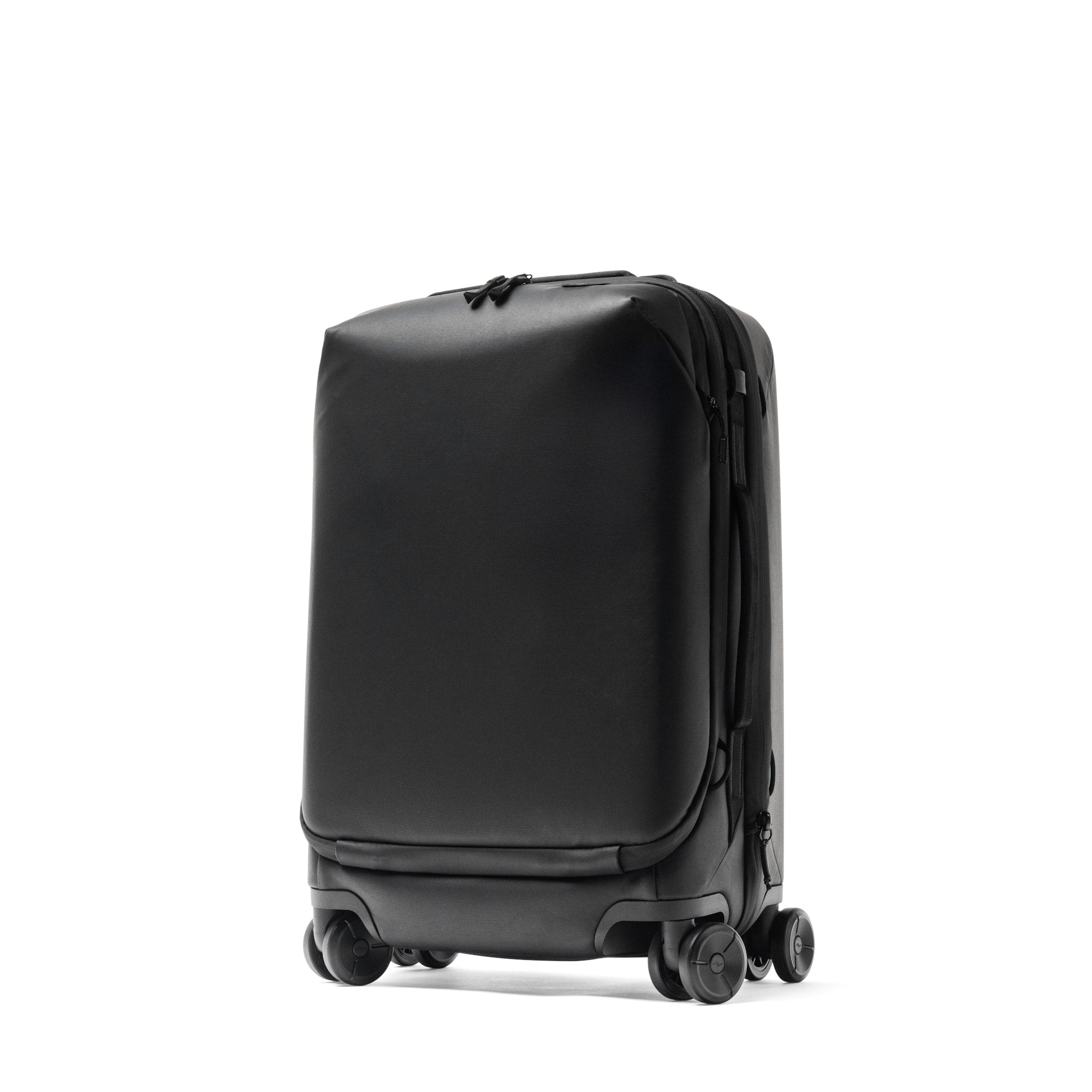 Peak Design Roller Pro Carry On Front Three Quarter View Peak Design Roller Pro Carry-On Suitcase In Black, Front Three-Quarter View On Four Spinner Wheels
