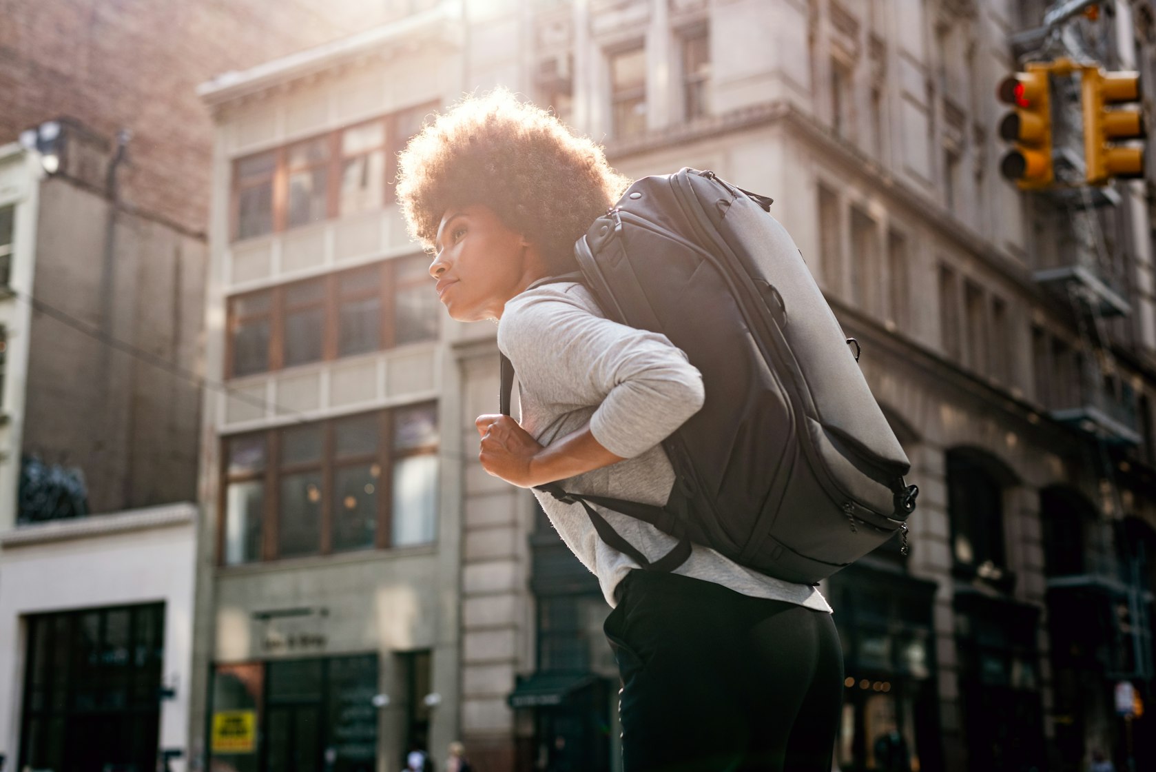 Peak Design Travel Backpack 45L Worn In The City A Traveller Wearing The Peak Design Travel Backpack 45L On A City Street