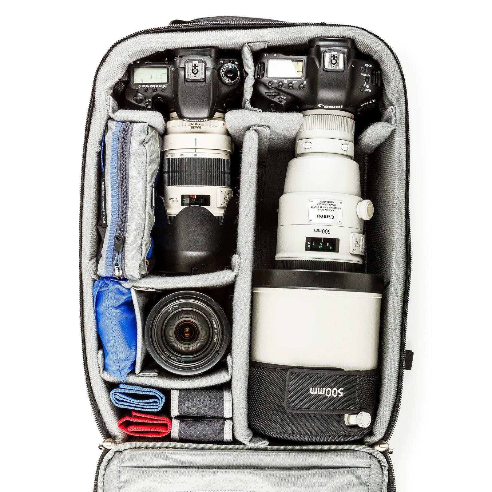 Think Tank Airport Accelerator Packed With Super Telephoto Lens Think Tank Airport Accelerator Open To Show Two Camera Bodies And A White Super-Telephoto Lens